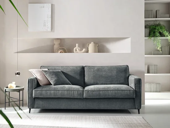 Canapé convertible gris foncé White vu de face dans un salon moderne