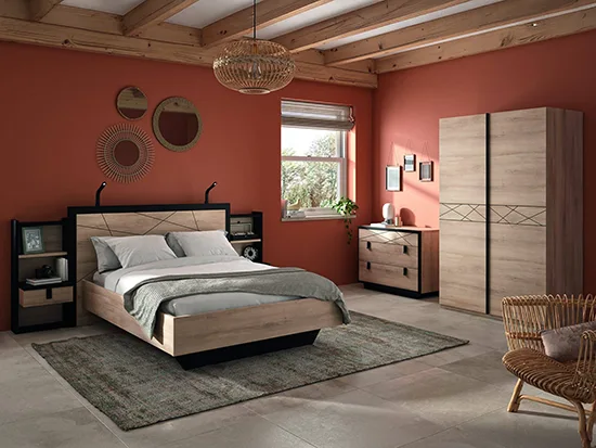 Chambre complète bois et métal noir avec lit, armoire et commode dans un décor nature